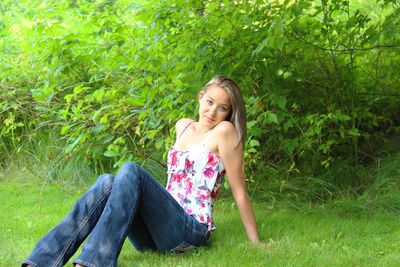 Woman sitting on grass