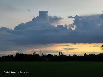 Scenic view of field against sky during sunset