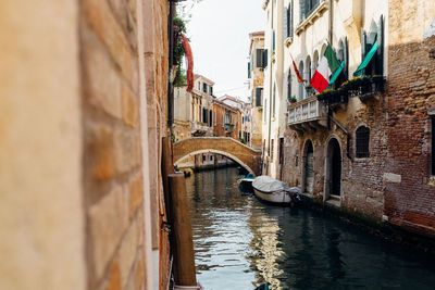 Canal amidst buildings in city