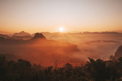 Scenic view of mountains against sky during sunset