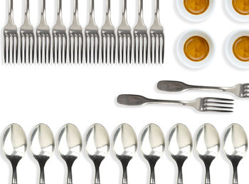Close-up of forks and spoon arranged on table