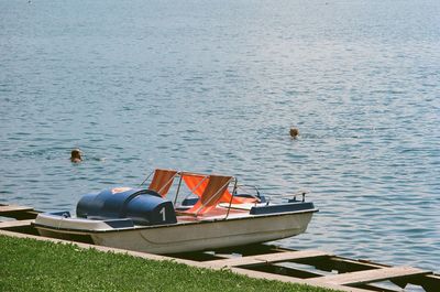 View of boats moored in lake