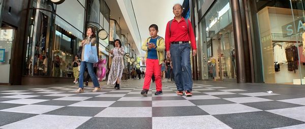 People standing on tiled floor