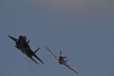 Low angle view of airplane flying in sky