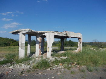 Built structure on landscape against sky