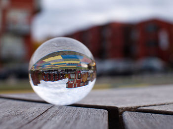 Close-up of glass ball on table