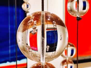 Close-up of electric lamp hanging on table