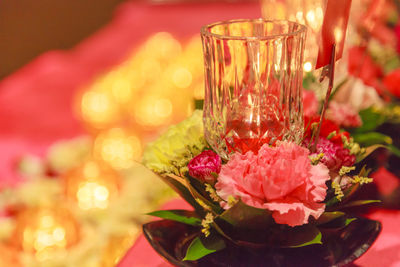 Close-up of red rose on table