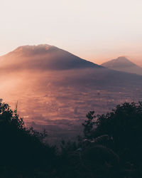 Scenic view of mountains against sky during sunset