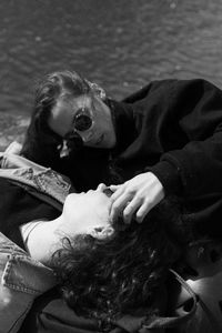 High angle view of couple romancing on boat in lake