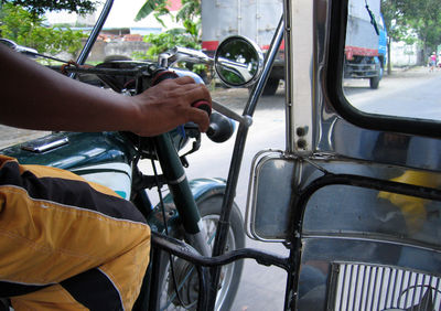 Man sitting in car