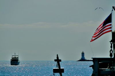 Boats in sea against the sky