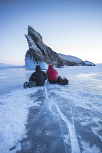 Two pohotographers waiting for the sunset in baikal lake.