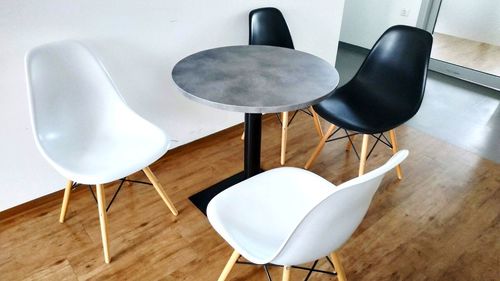 High angle view of empty chairs on table