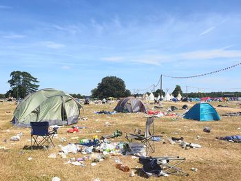 Tents on field against sky