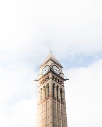 Low angle view of clock tower against sky