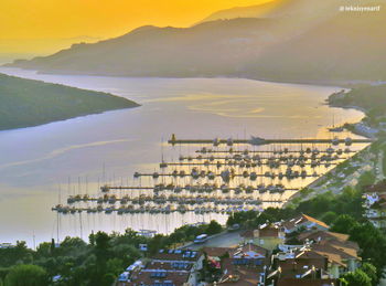 High angle view of townscape by sea against sky