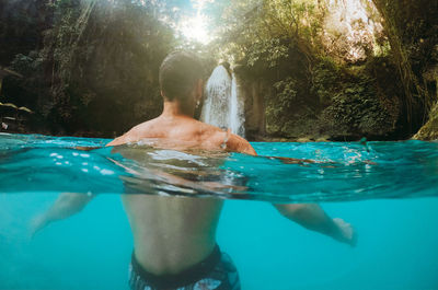 Man swimming in pool