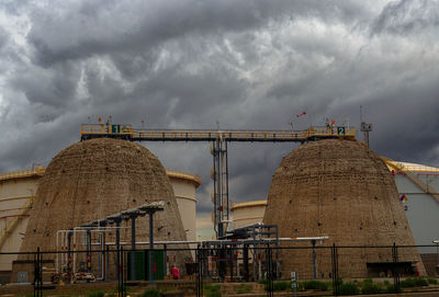 Low angle view of building against cloudy sky