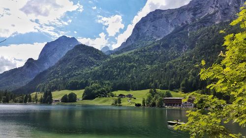 Scenic view of lake and mountains against sky