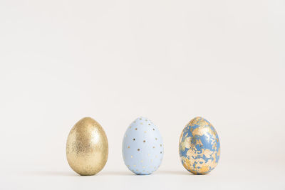 Close-up of christmas decorations on white background