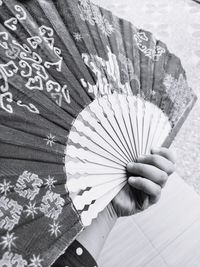 High angle view of woman holding umbrella