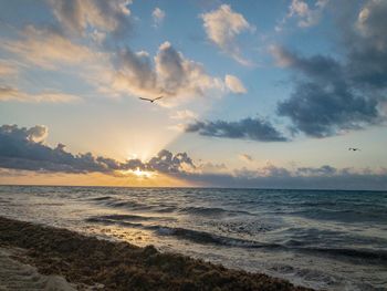 Scenic view of sea against sky during sunset