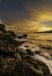 Scenic view of sea against sky during sunset