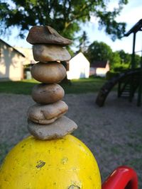 Close-up of stone stack on field