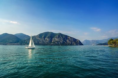 Scenic view of sea with mountains in background