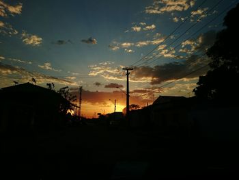 Silhouette of built structure at sunset