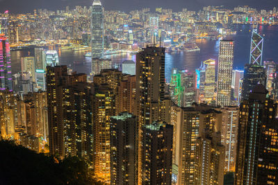 Aerial view of illuminated buildings in city at night