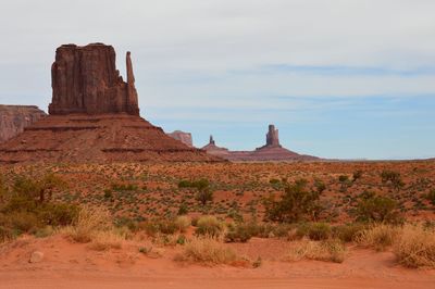 Rock formations on landscape against sky