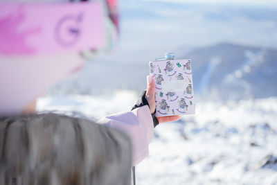 Midsection of woman holding gift