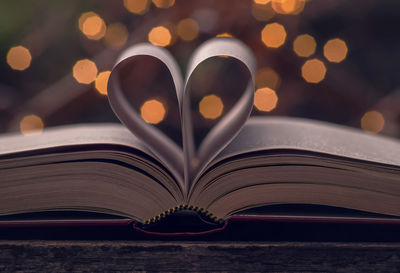 Close-up of heart shape on book