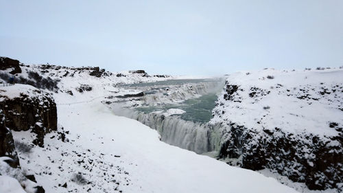 Gullfoss waterfall view in the canyon of the hvita river during winter snow in iceland.