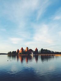 Trakai island castle by lake galve against sky