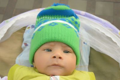 Portrait of cute baby boy in knit hat