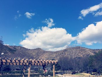 Scenic view of mountains against cloudy sky