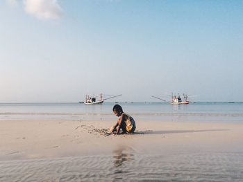 Scenic view of sea at sunset