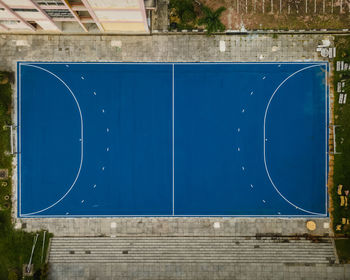 Low angle view of building against blue wall