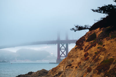 Bridge over sea against sky