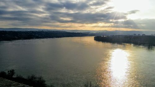 Scenic view of lake against sky during sunset