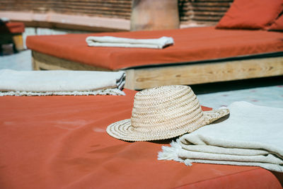 A straw hat on a sunbed