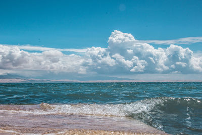 Scenic view of sea against blue sky