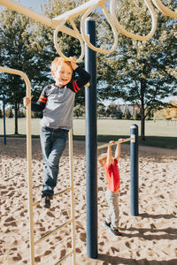 Boy playing on slide at playground