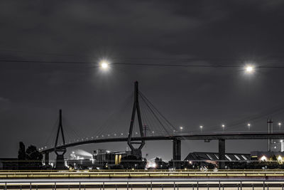 Low angle view of suspension bridge at night