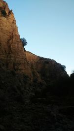 Low angle view of rock formations against sky