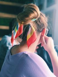 Close-up of woman with hair bun