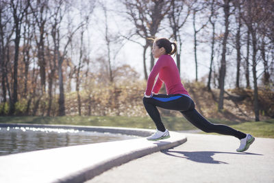 Woman stretching in park